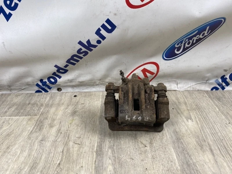 Суппорт тормозной KIA RIO 2010