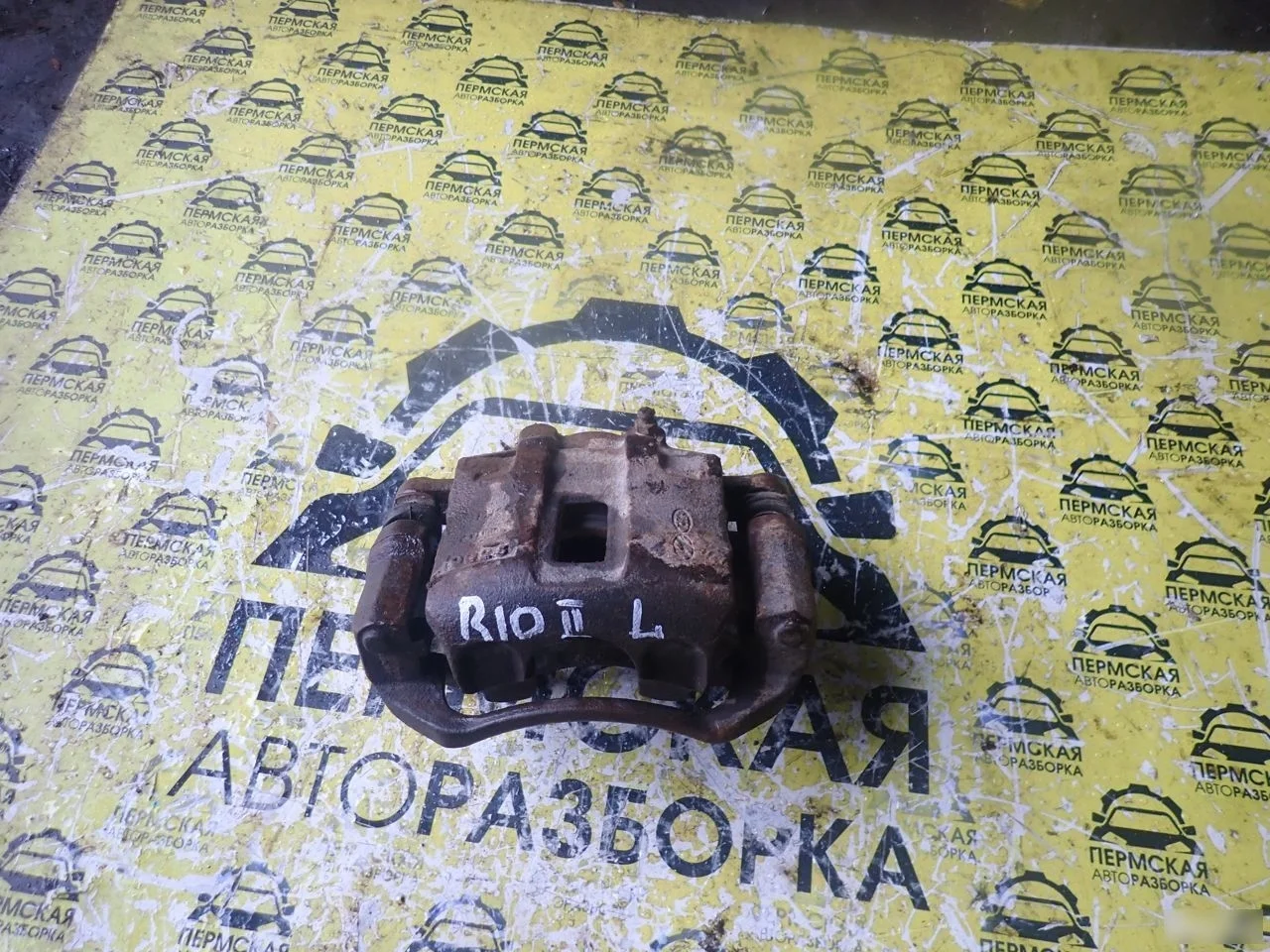 Суппорт тормозной передний левый для Kia RIO 2