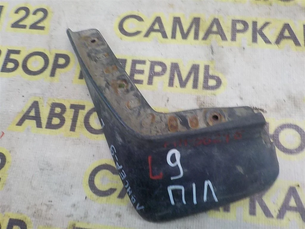 Брызговик передний левый Mitsubishi Lancer 9 (CS) 2003-2006