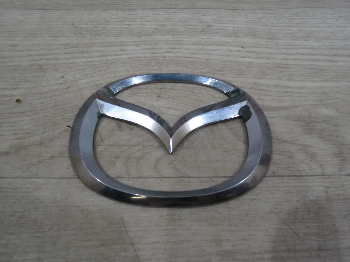 Эмблема Mazda 3 BK