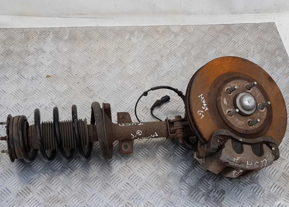 Амортизационная стойка передняя левая Ford  104613
