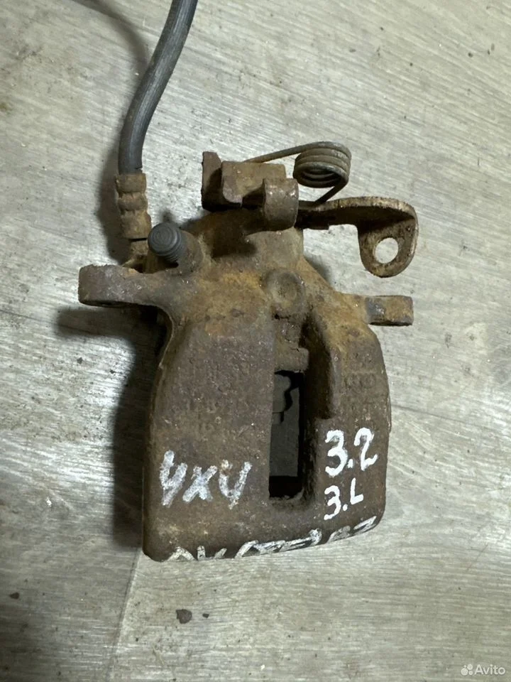 Суппорт тормозной задний левый vag