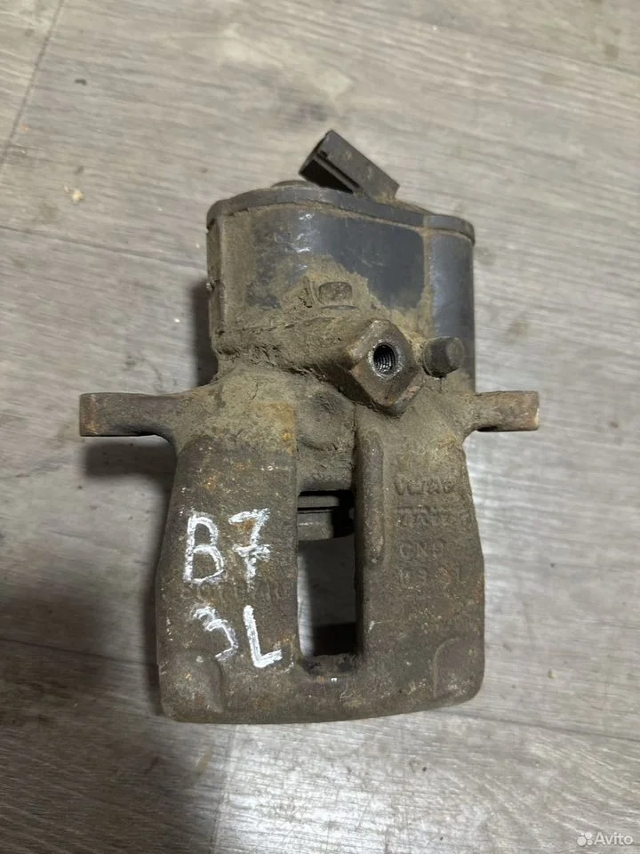 Суппорт тормозной задний левый с электромотором va