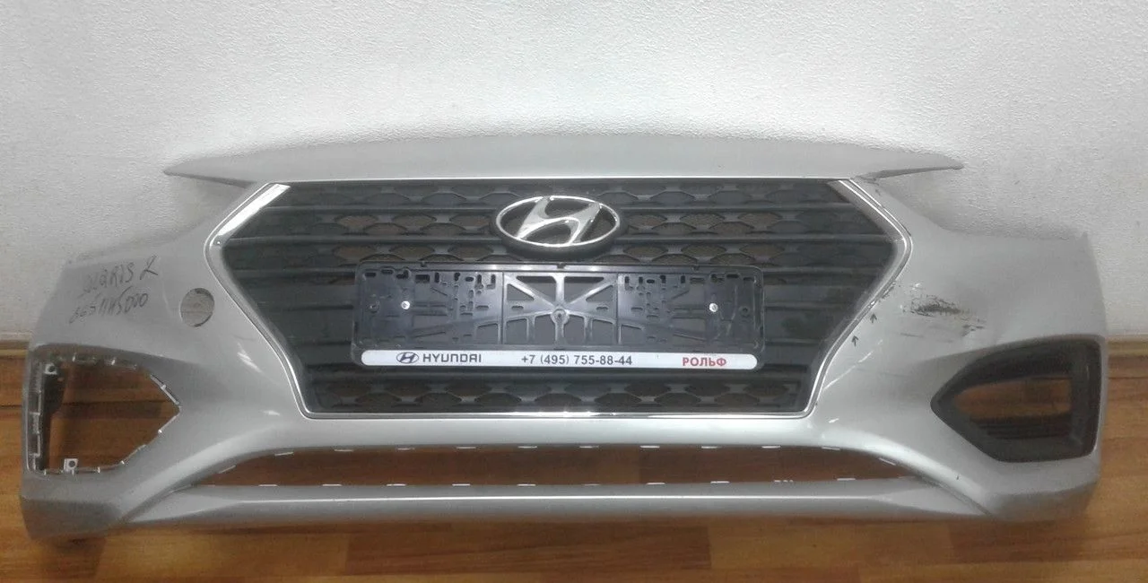 Бампер передний с решеткой Hyundai Solaris 2 oem 86511h5000 (трещины, слом. бок. крепление)