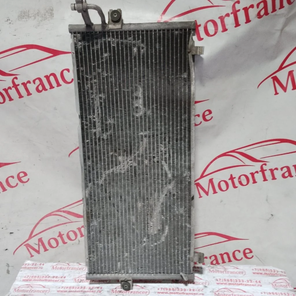 Радиатор кондиционера (конденсер) Nissan Primera 921109F515 P11