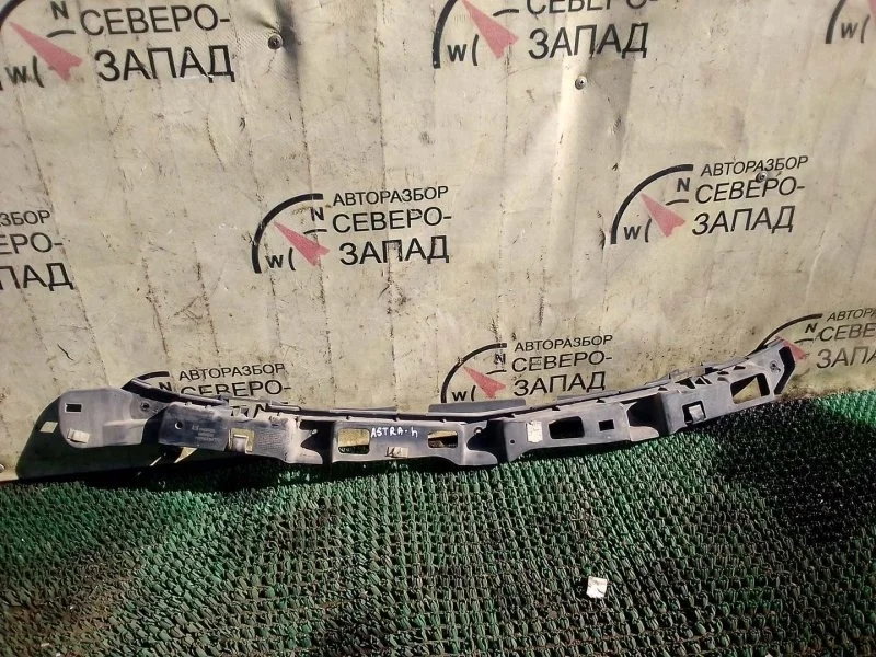 Кронштейн бампера Opel Astra 24460528 H, задний