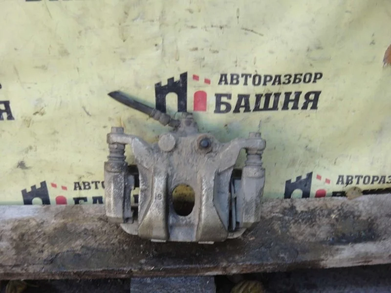 Суппорт тормозной Nissan Patrol 440111LB0A, задний левый