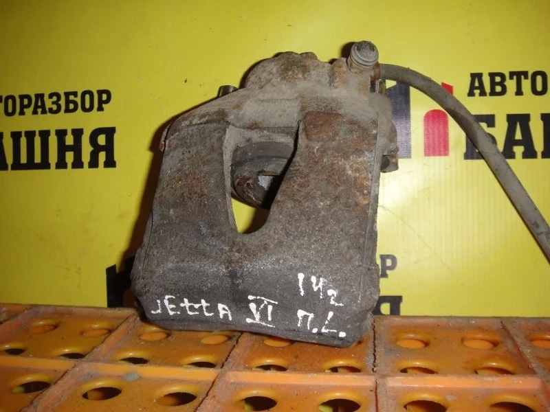 Суппорт тормозной Volkswagen Jetta 1K0615123D, передний левый