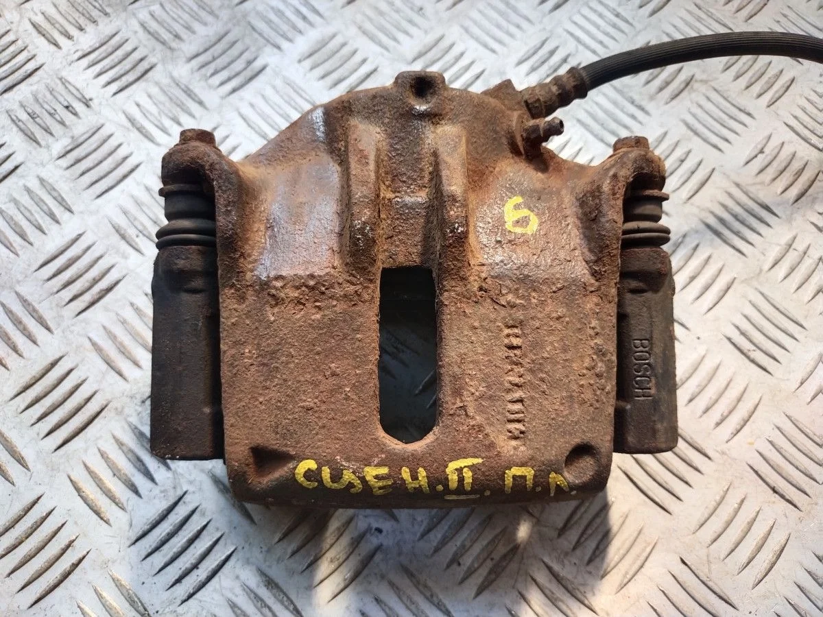 Суппорт тормозной передний левый Renault Scenic