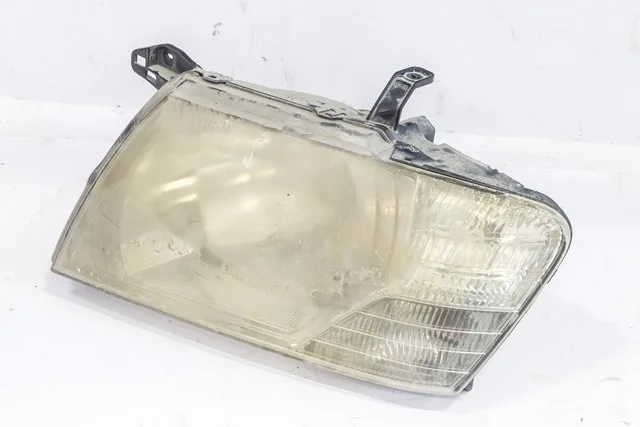 Фара левая V75W MITSUBISHI PAJERO III / MONTERO III V6 / V7 2003-2006