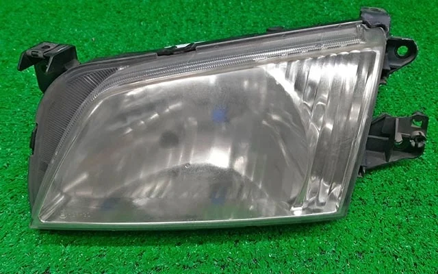 Фара левая (под полировку) DW3W MAZDA DEMIO DW 1999-2003