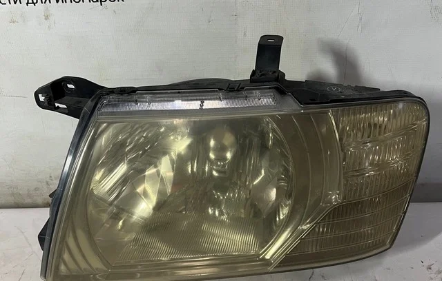 Фара левая V75W MITSUBISHI PAJERO III / MONTERO III V6 / V7 2003-2006