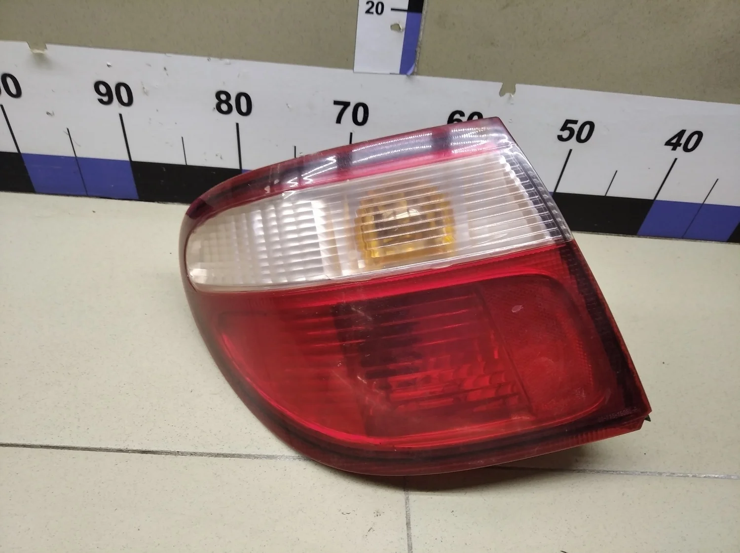Фонарь задний наружный левый Almera N16 2000-2006