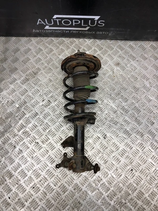 Стойка подвески Nissan Primera 54302AV425 P12 QG16DE, передняя левая