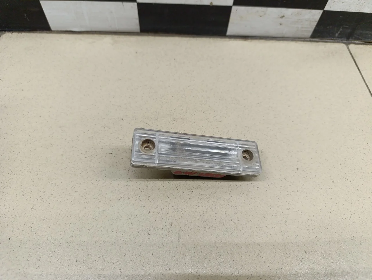 Фонарь подсветки номера Aveo (T200) 2003-2008