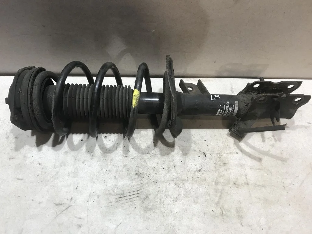 E4303JE21A Амортизатор левый Nissan Qashqai J10