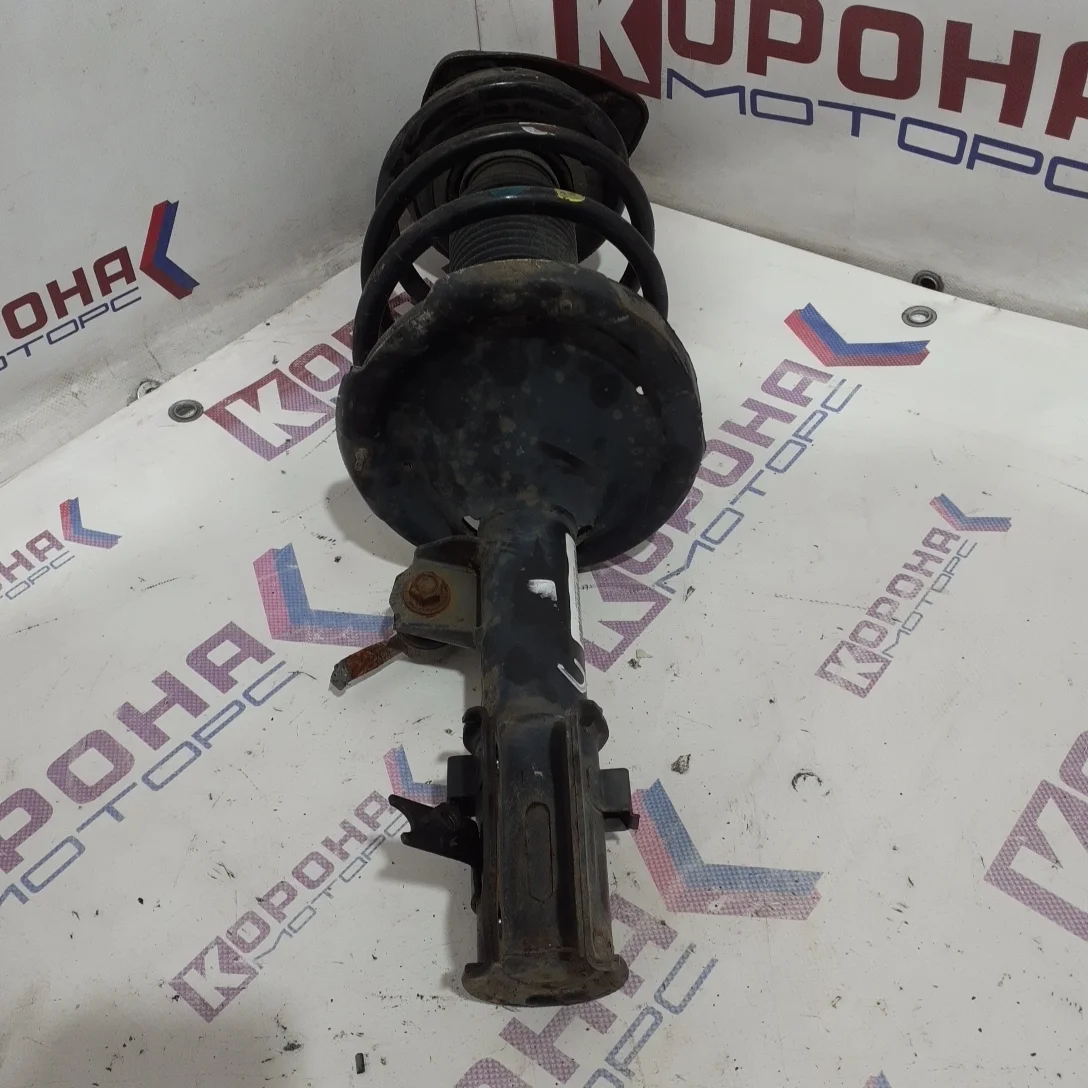 Амортизатор передний правый Б/У в сборе