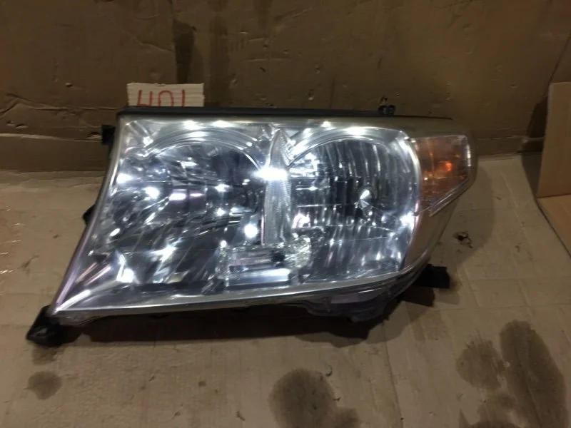 Фара левая Toyota Land Cruiser 2010 8117060C82 URJ200 1VD-FTV 4.5, передняя левая
