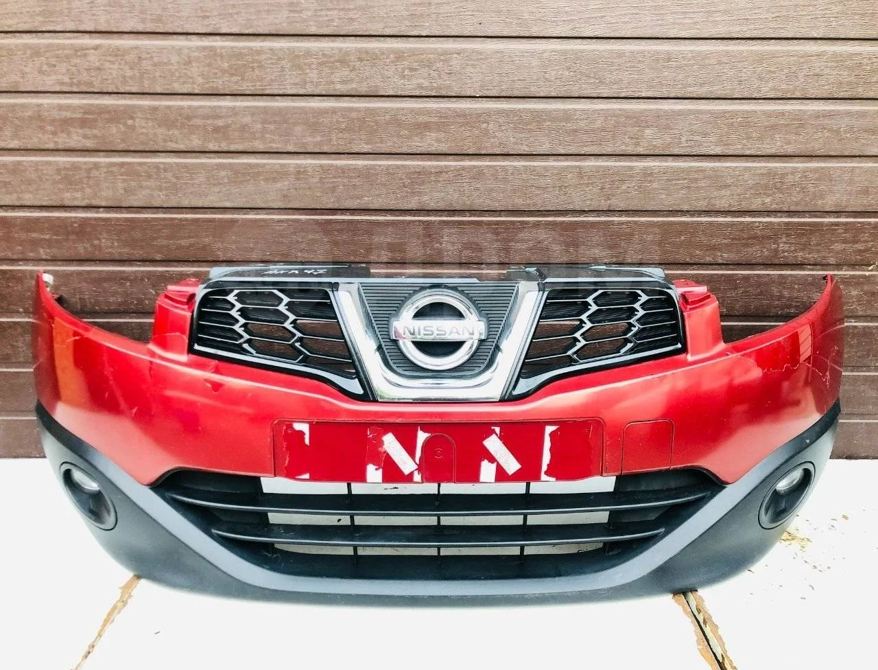 Бампер передний Nissan Qashqai+2 I рестайлинг (2010—2013)