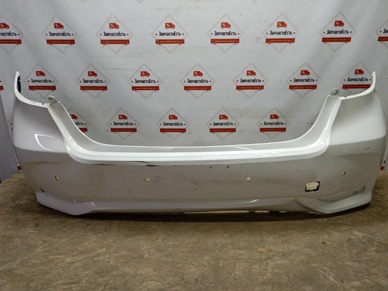 Бампер задний Toyota Corolla 521590Z953 E210