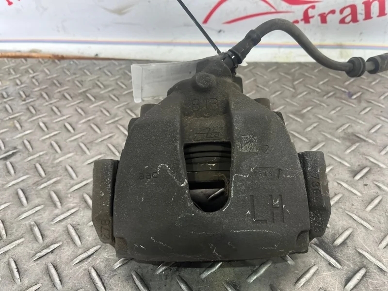 Суппорт тормозной Ford Focus 2004-2011 1682876 2, передний левый