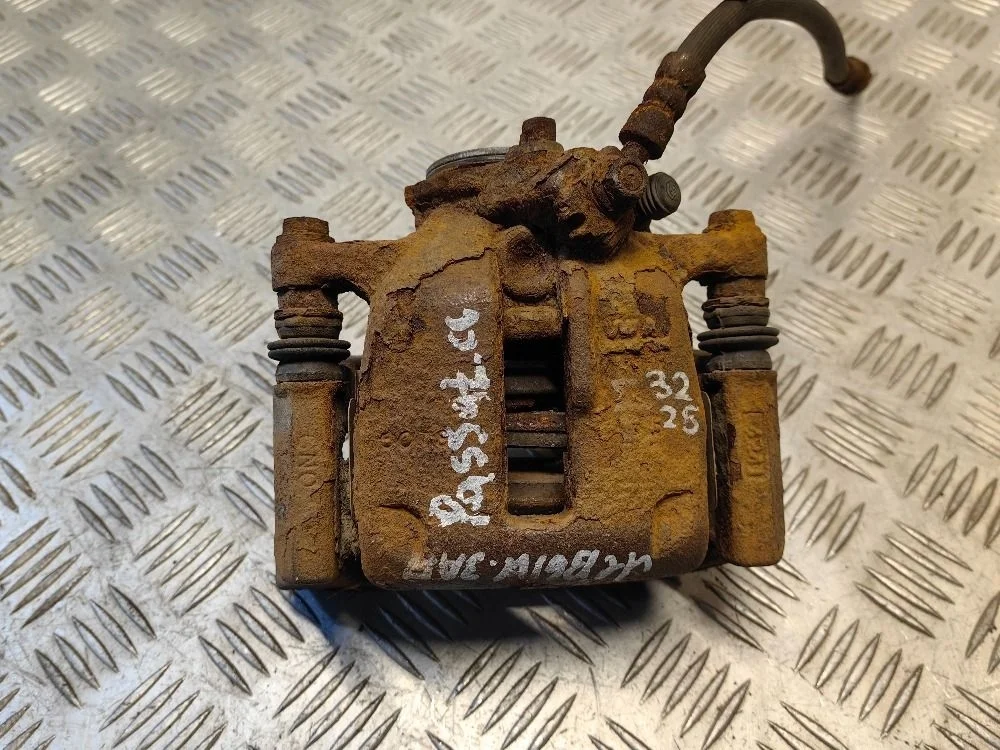 Суппорт задний левый Volkswagen Passat B6