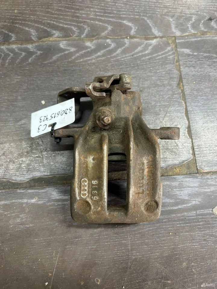 Суппорт тормозной задний левый vag 8d0615423