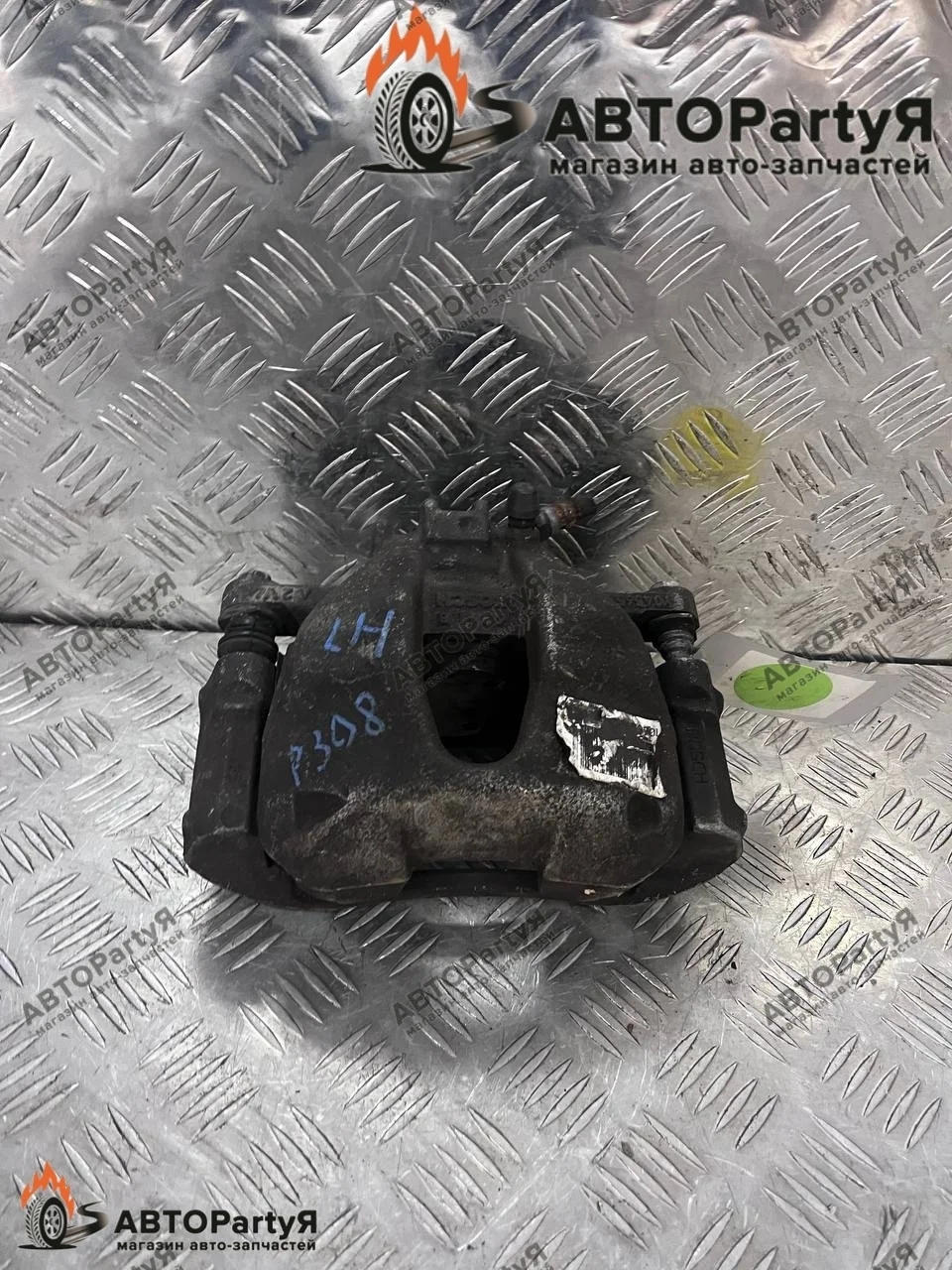 Суппорт тормозной передний левый Peugeot (Пежо)  208