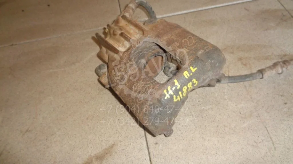 Суппорт передний левый Ford Focus 1