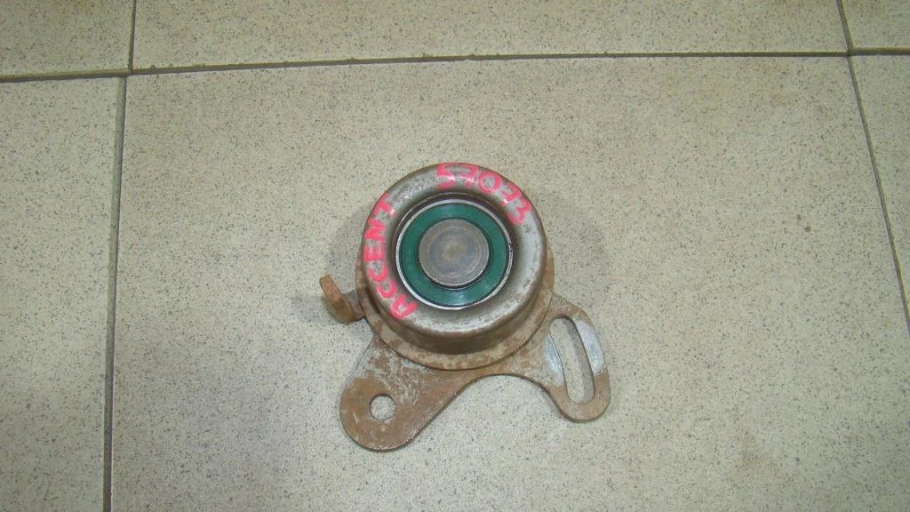 Ролик-натяжитель ремня грм Hyundai Accent LC