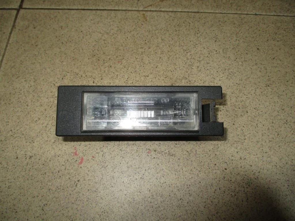 Фонарь подсветки номера Opel Astra J