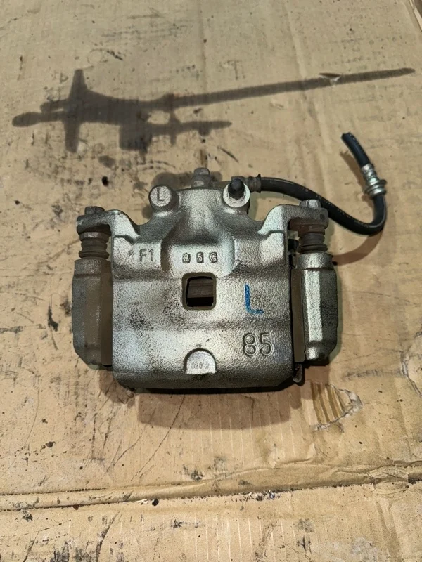 Суппорт тормозной Nissan Teana 41011JN00A J32 VQ25DE 2.5, передний левый