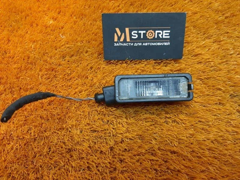 Подсветка номера Volkswagen Passat 2011 1K8943021 B7 CAXA