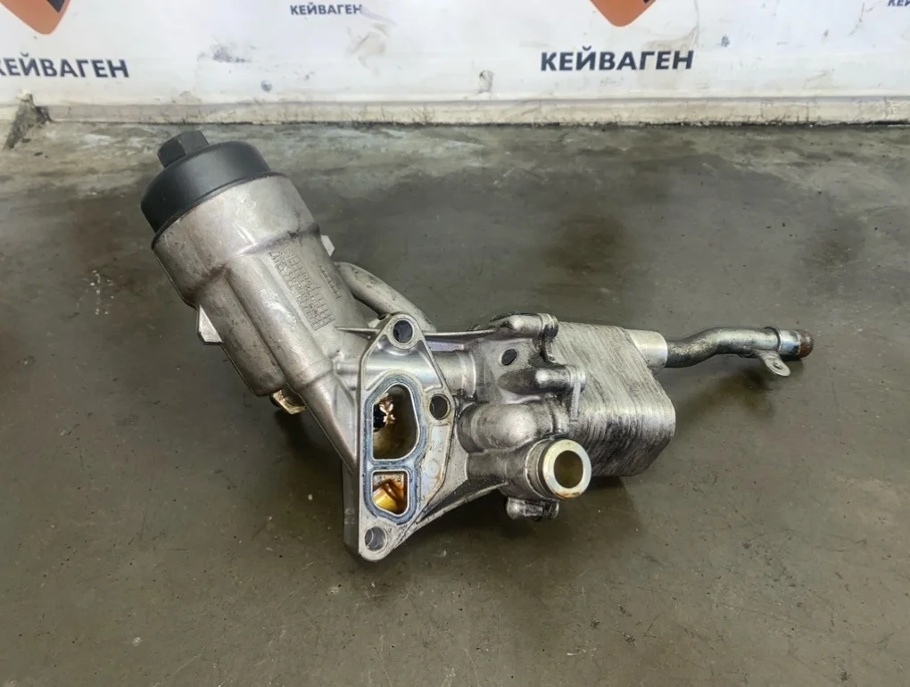 Корпус масляного фильтра теплообменником Opel Astra 2011 J