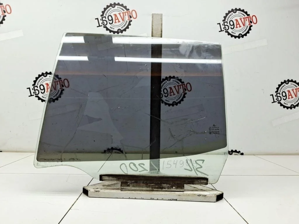 Стекло двери задней левой Mitsubishi L200 2012 KA, KB