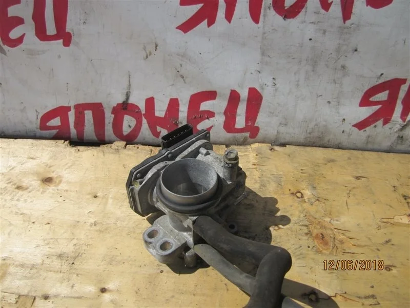 Дроссельная заслонка Toyota Vitz 2203023010 SCP90 2SZ-FE