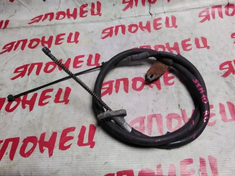 Тросик ручника Toyota Ipsum 4643044010 SXM10 3S-FE, левый