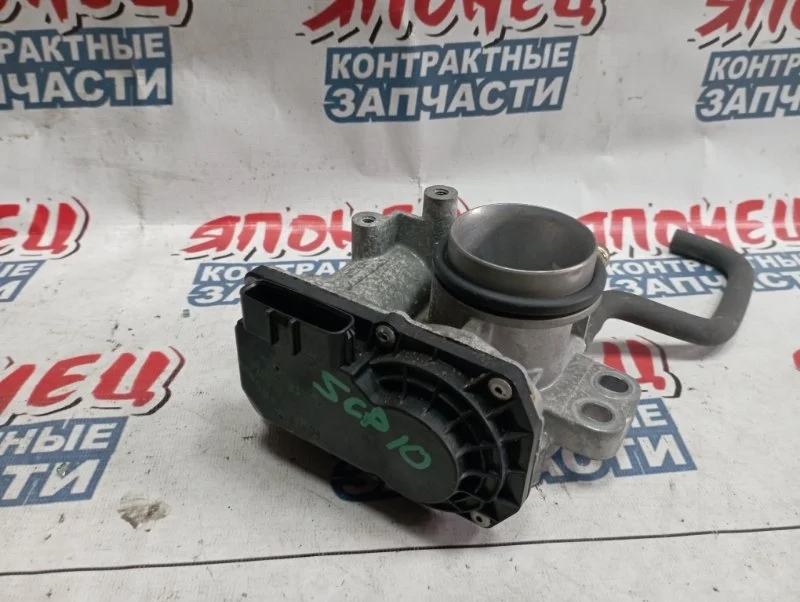 Дроссельная заслонка Toyota Vitz 2203023010 SCP13 2SZ-FE
