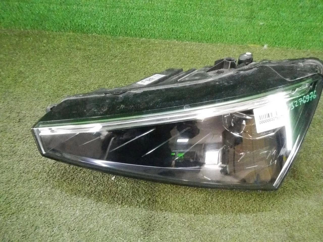 Фара левая Skoda Rapid
