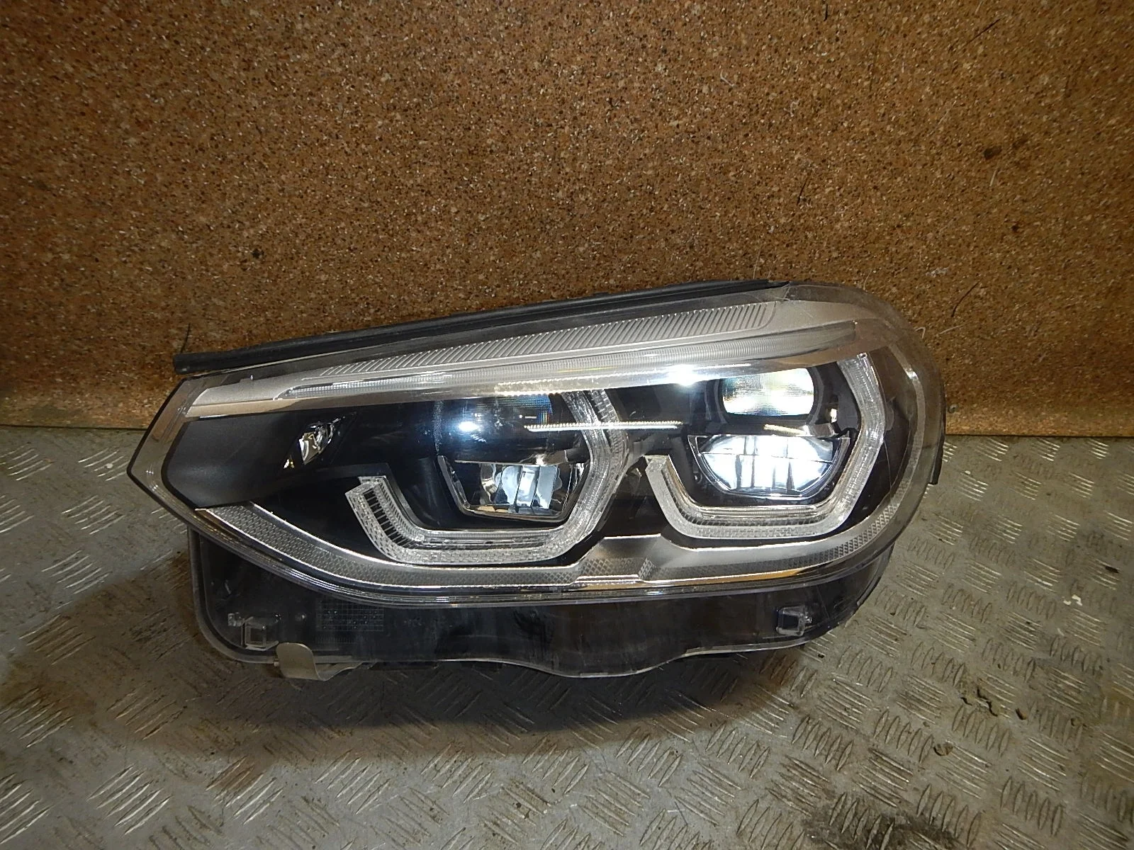 Фара левая BMW X3