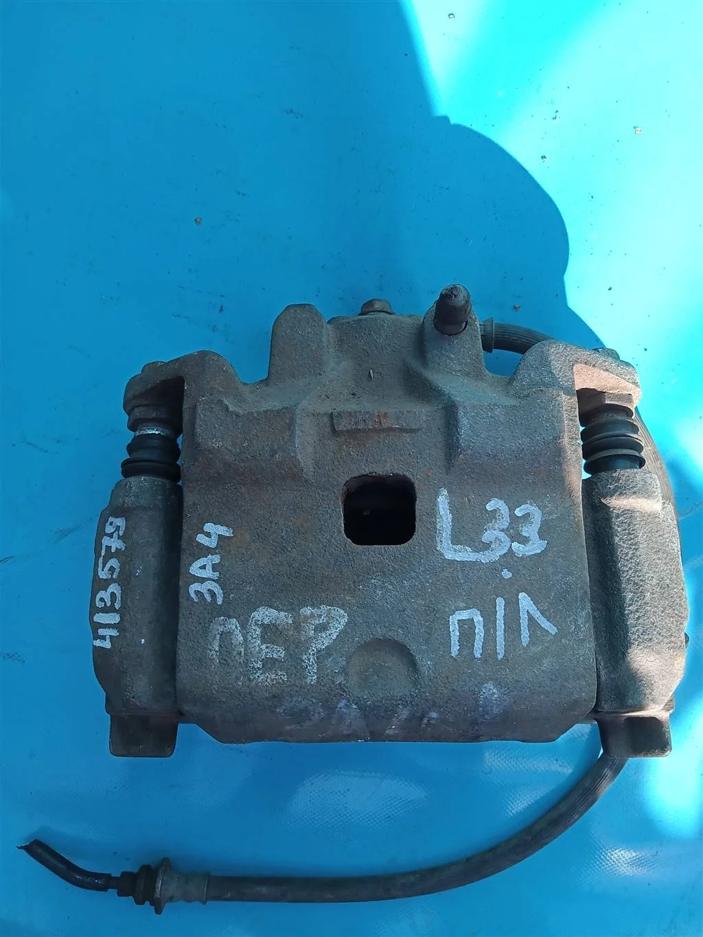 Суппорт тормозной передний левый Nissan Teana L33