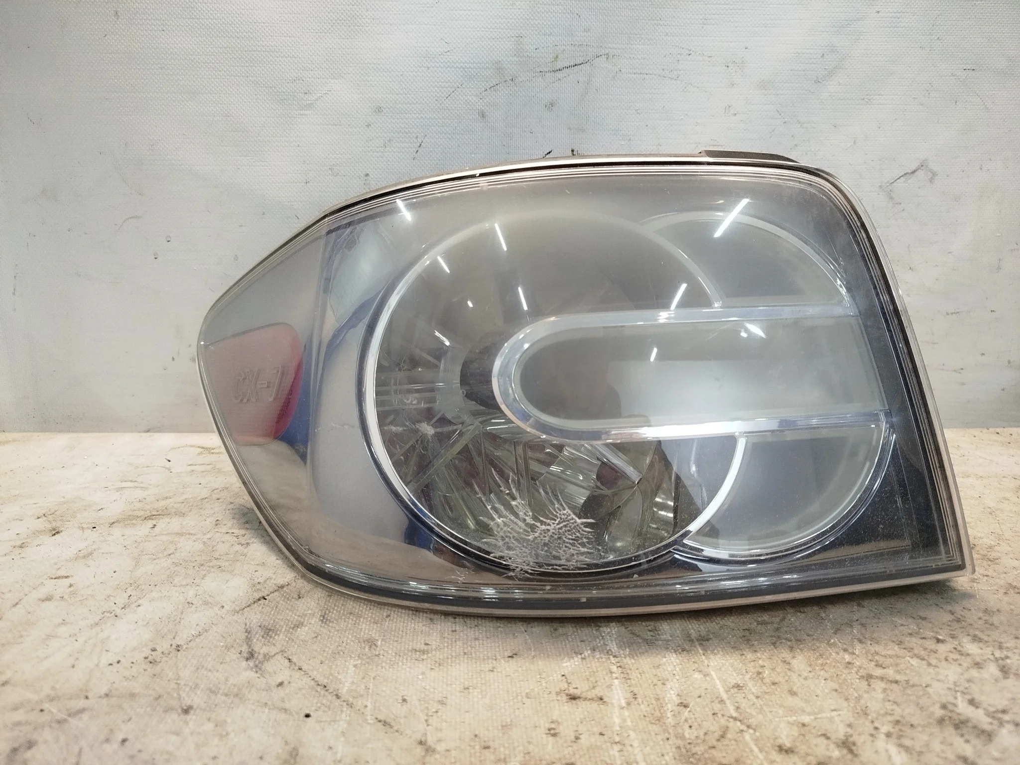 ФОНАРЬ MAZDA CX-7 ER3P ER5P 22061583 ЛЕВЫЙ E22151160B QE219