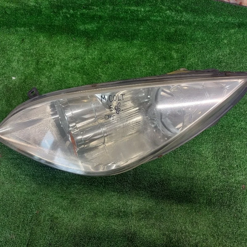 Фара левая Mitsubishi Colt 2004