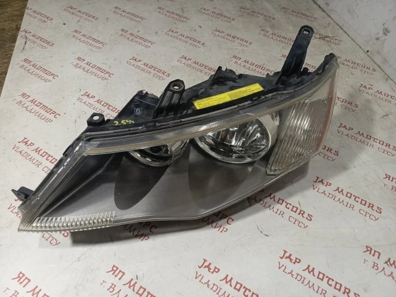 Фара ксеноновая передняя левая Mitsubishi