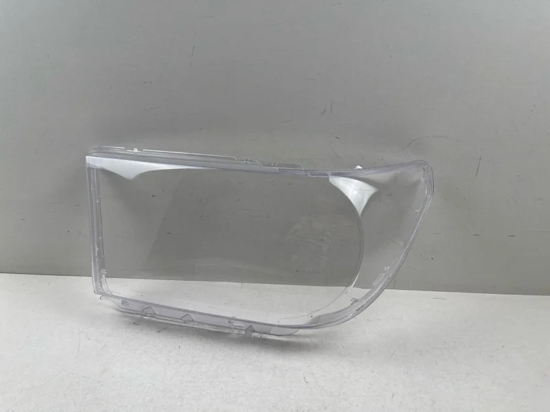 Стекло фары Toyota Tundra 2007- 811100C050 2, левое