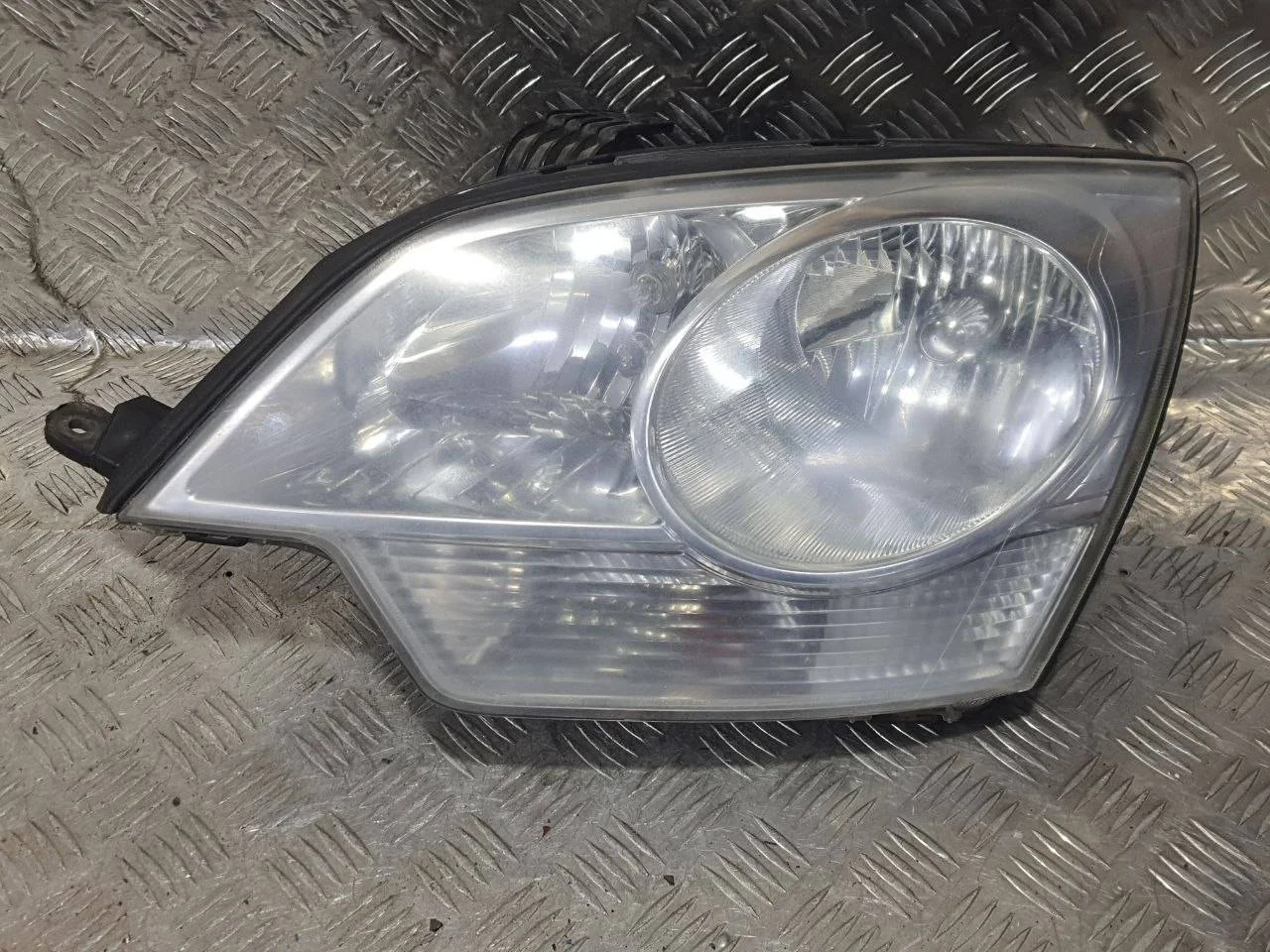 фара левая Opel Antara