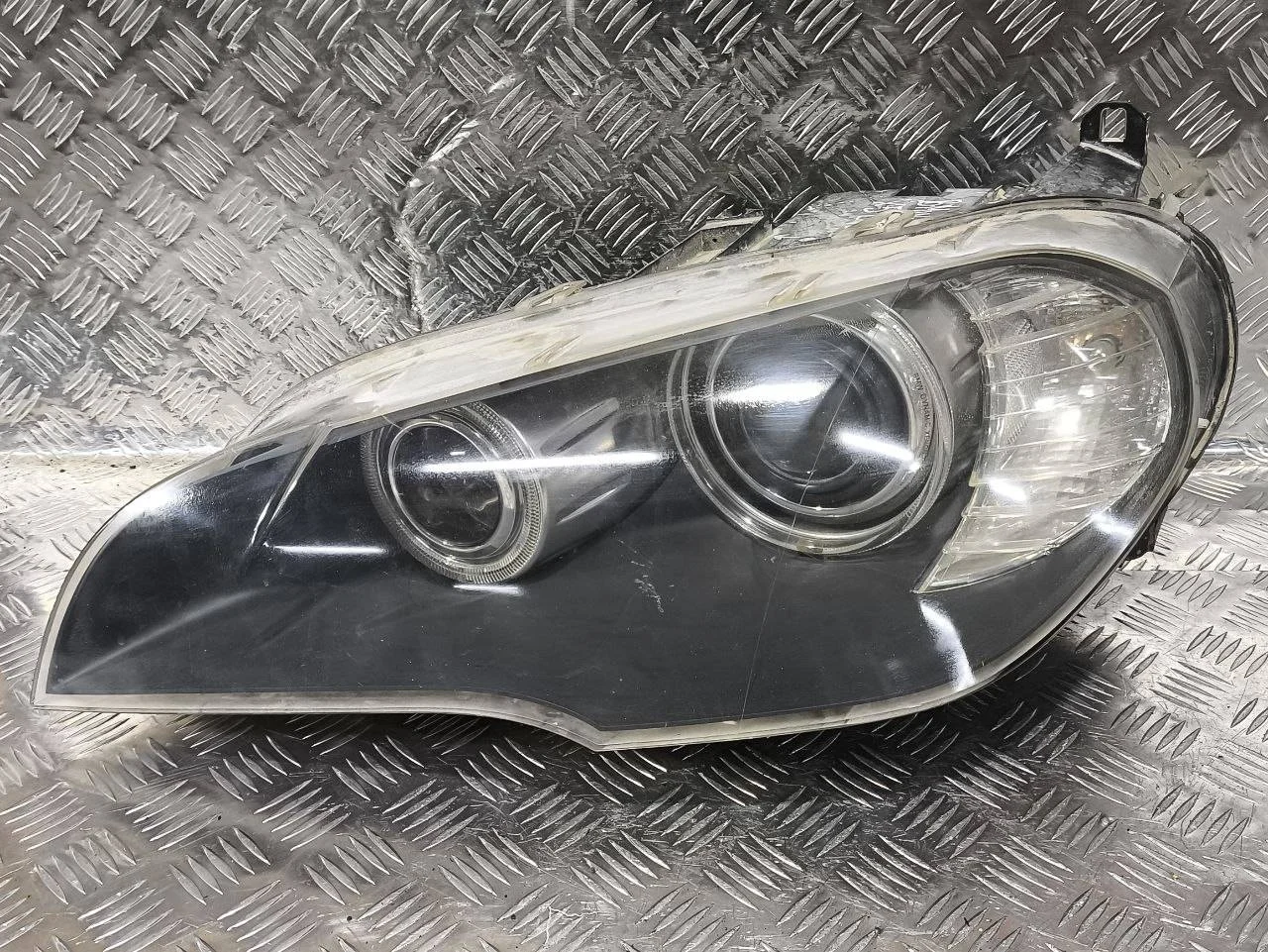 фара левая BMW X5 E70