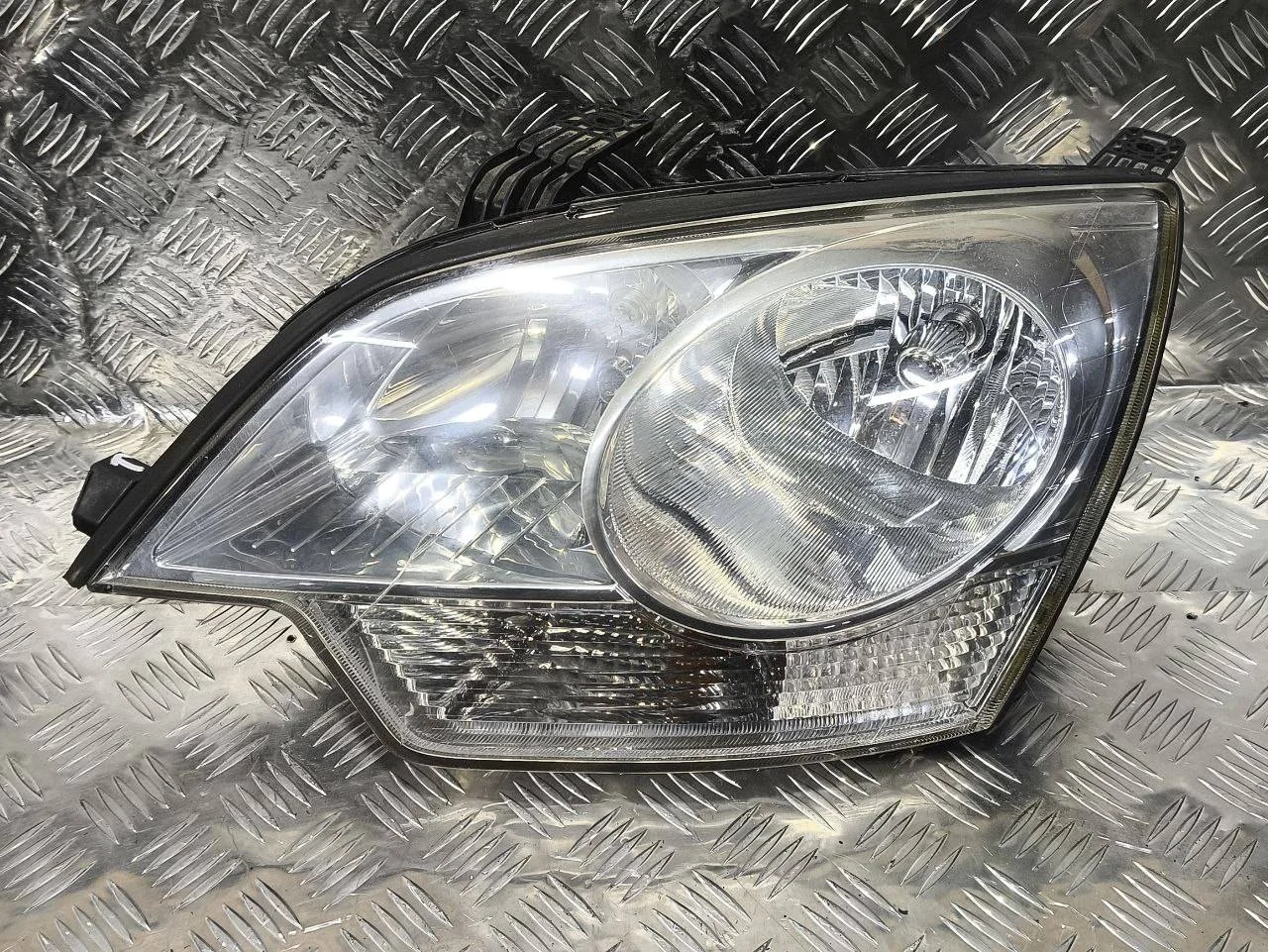 фара левая Opel Antara