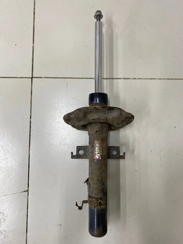 Амортизатор передний левый Nissan X-Trail T32