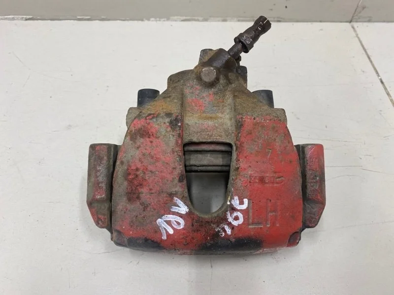 Суппорт тормозной передний левый Ford Focus 2